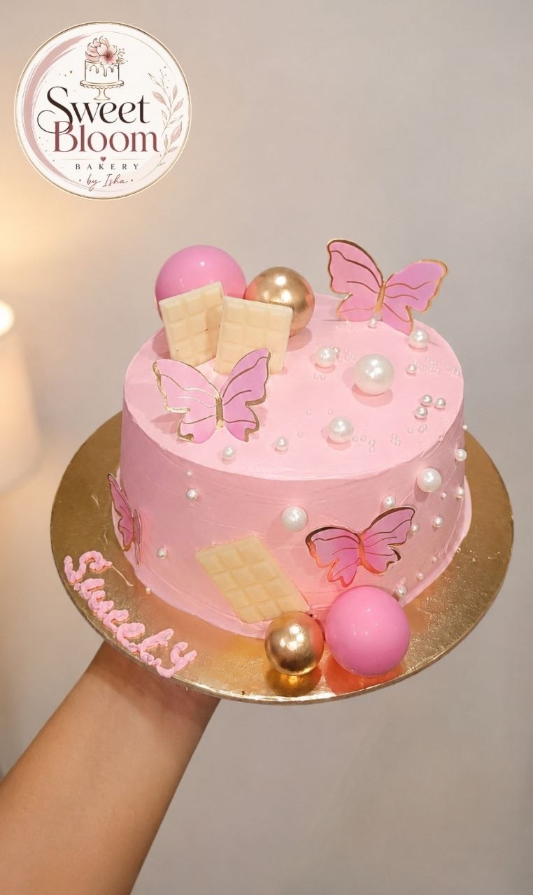 Pink butterfly theme cake with edible wafer butterflies, pearls and gold spheres — Sweet Bloom Bakery, Asansol