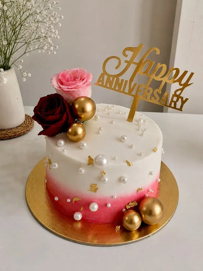 Pink ombre anniversary cake with pearls and fresh roses — Asansol